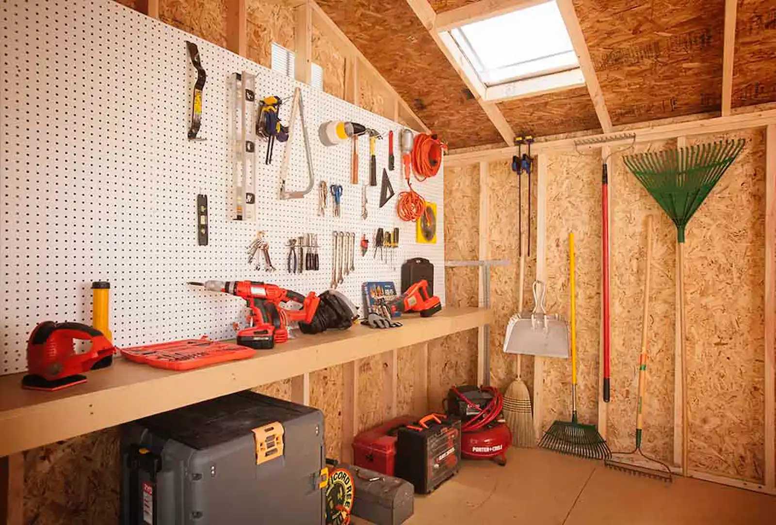 Interior of Tuff Shed with pegboard wall and shelving