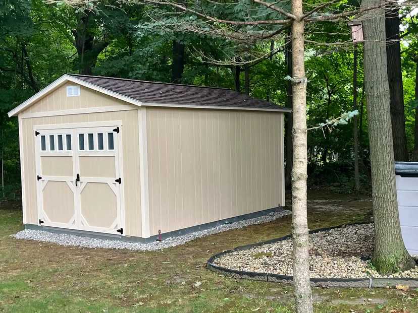 TR-800 building with lower door trim and in-door vertical transom windows in a backyard