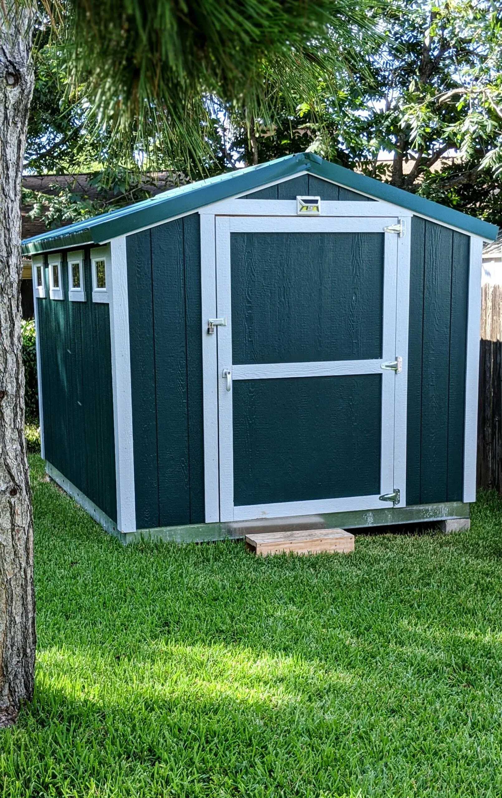 Sr-600 used as a storage shed for someones backyard. The shed is painted green and has white trim.
