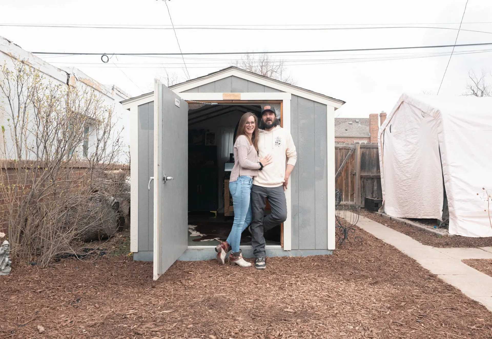 Exterior of SR-600 transformed into a woodworking studio with a couple standing in front
