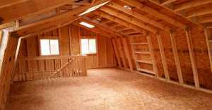 Second level finished shed Unfinished second level with wooden beams, two windows, and a staircase. Walls and floor are made of plywood. Natural light illuminates the space.