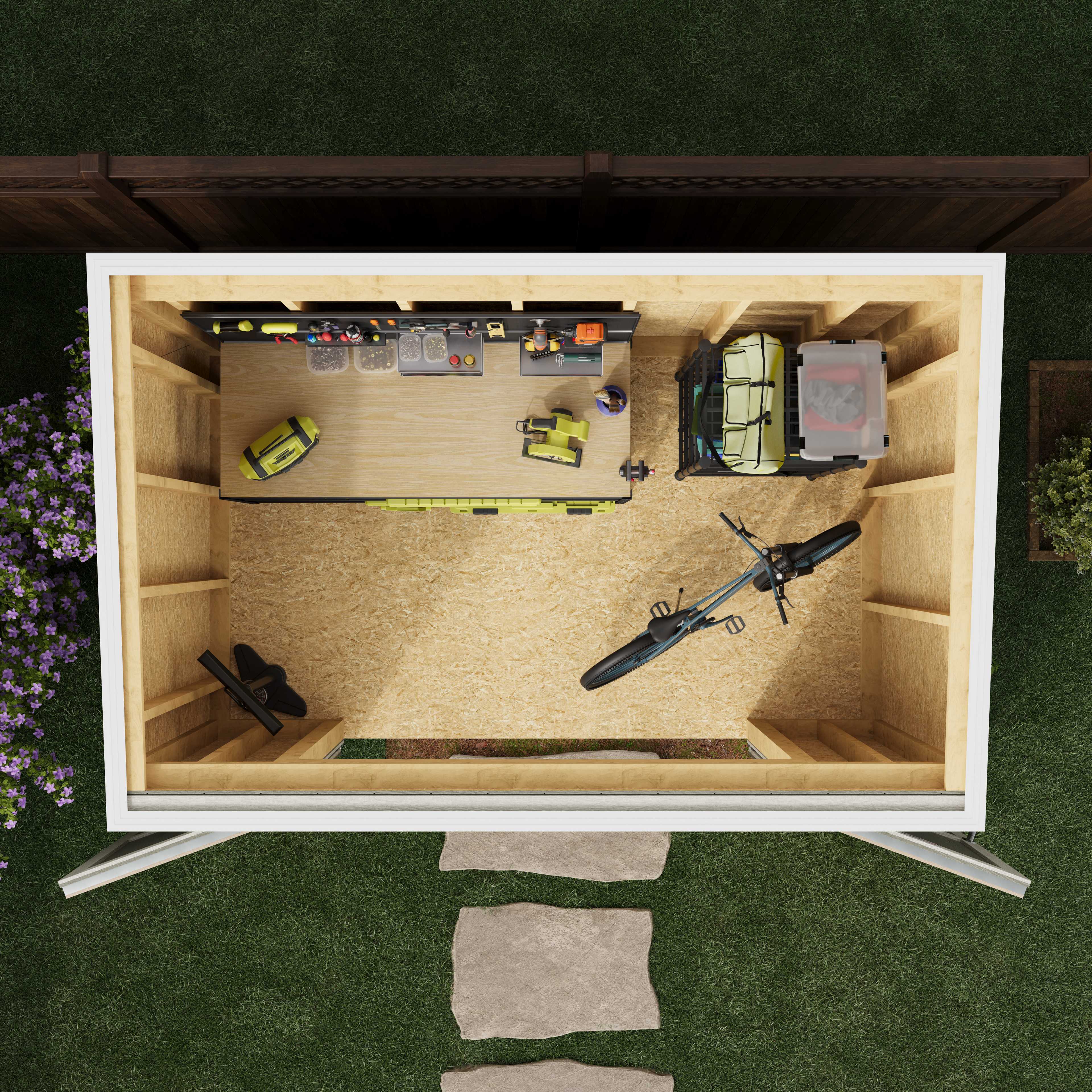 Aerial view of a tidy shed interior with a workbench, tools, bicycle, and storage, situated next to a wooden fence and surrounded by grass.