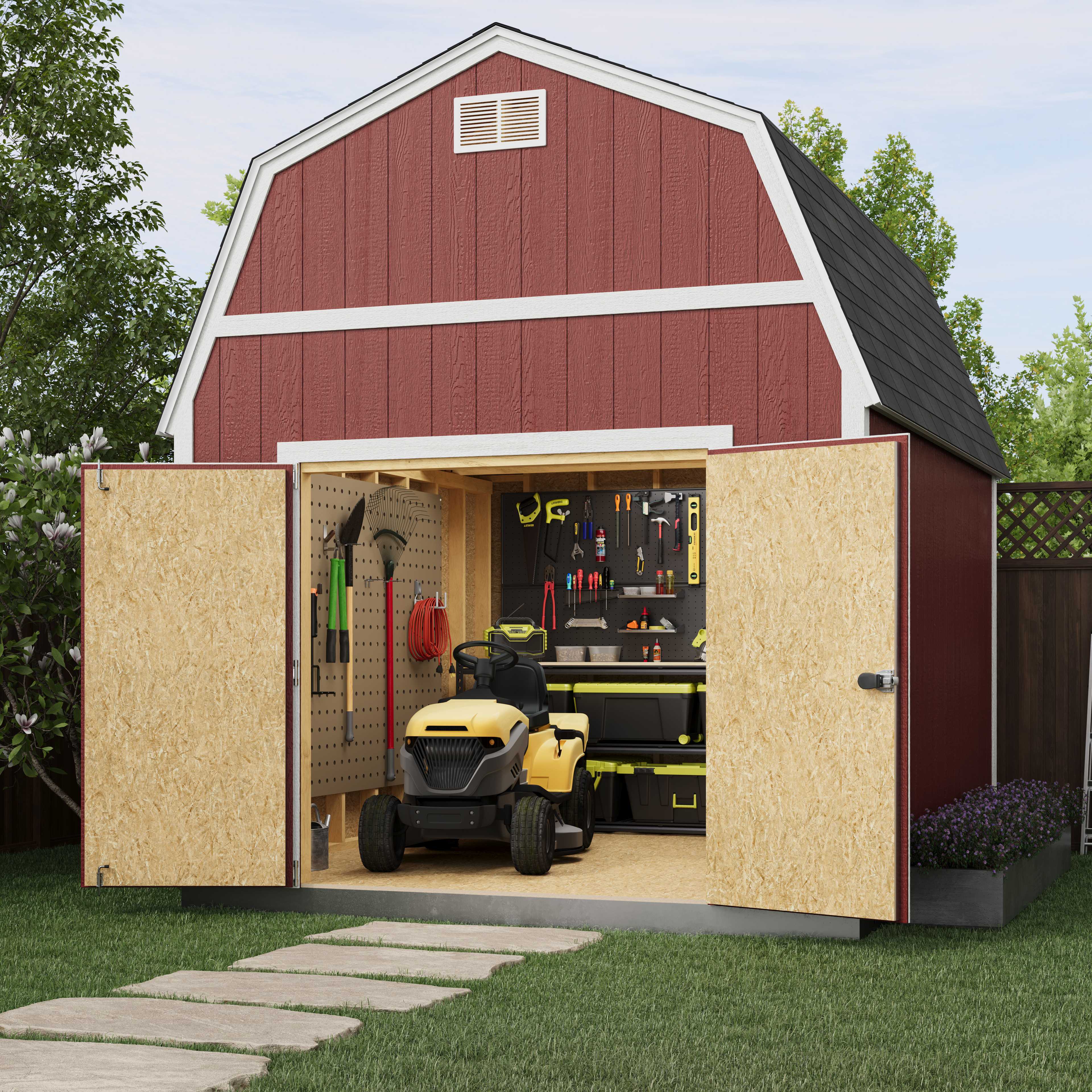 A red barn-style shed with open doors, showing a yellow riding lawn mower and organized tools on the wall inside. A stone path leads to the shed.