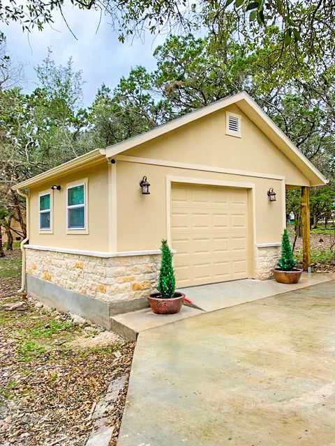 A large yellow Sundance Ranch Garage