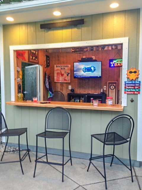 Outdoor party bar shed with high stools