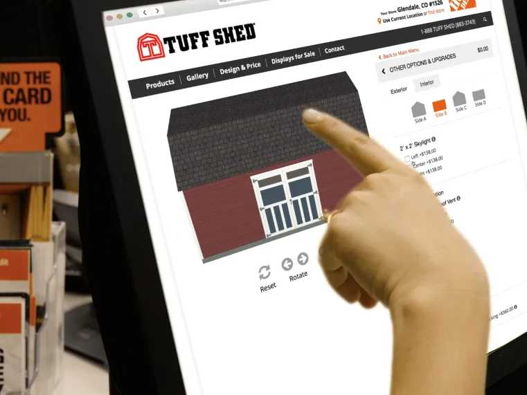 A customer using design tool to customize a shed at the home depot